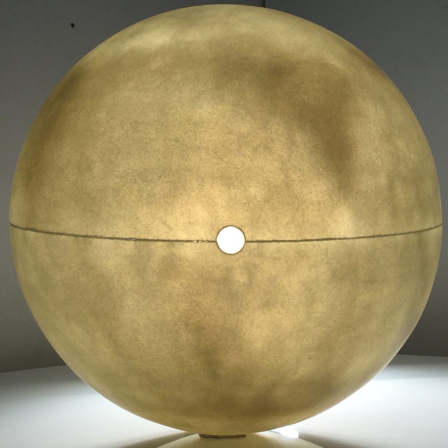 A translucent fibreglass sphere lit from inside, the light glowing through its surface